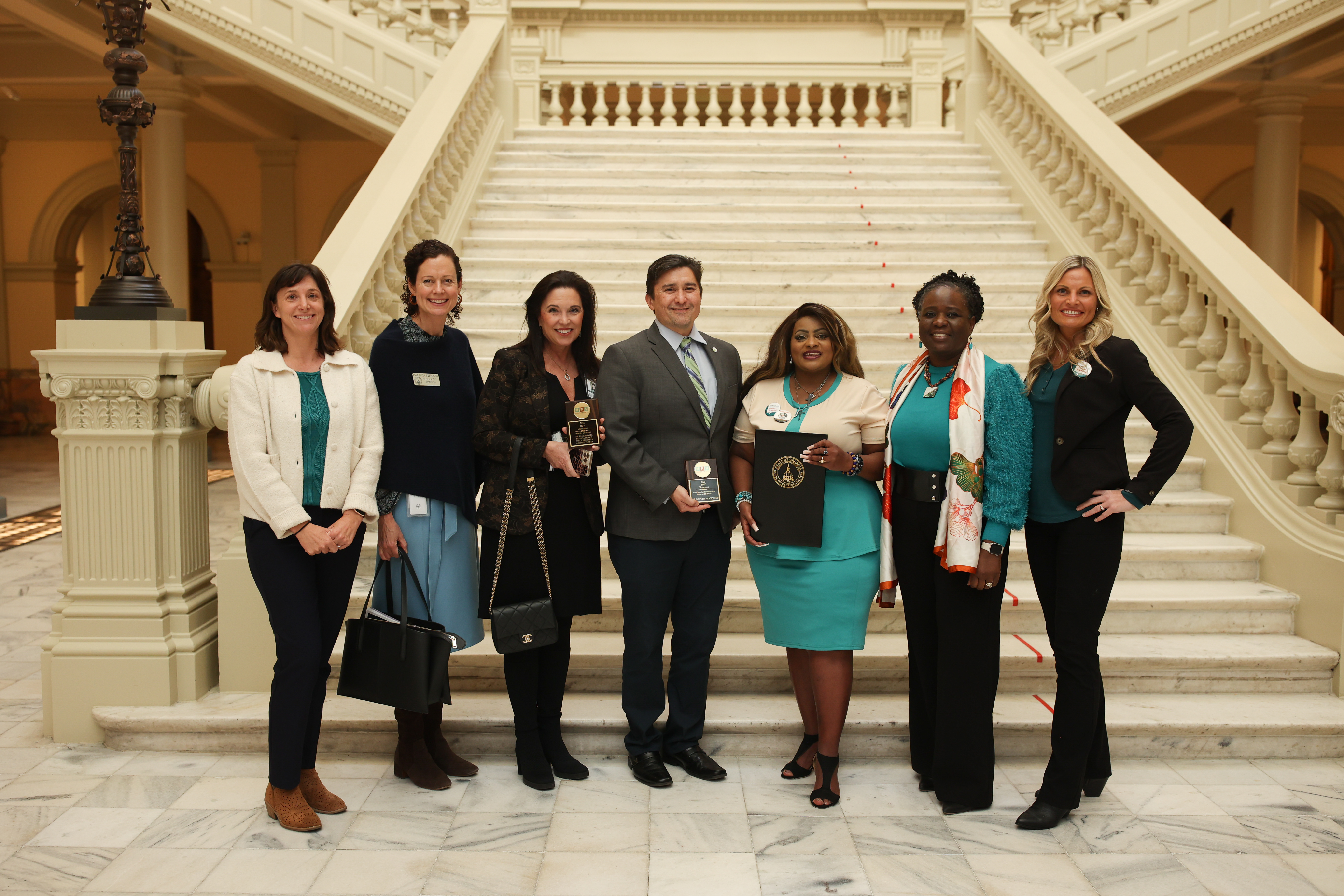 The 2025 HPV Champions stand with the HPV Cancer Free GA tri-chairs and legislators at the 8th Annual Cervical Cancer Awareness Day.